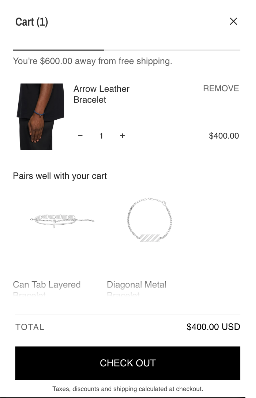 A Shopify cart screenshot showing a removed 'Arrow Leather Bracelet' priced at $400.00 from the cart, alongside suggestions for layered and diagonal metal bracelets.