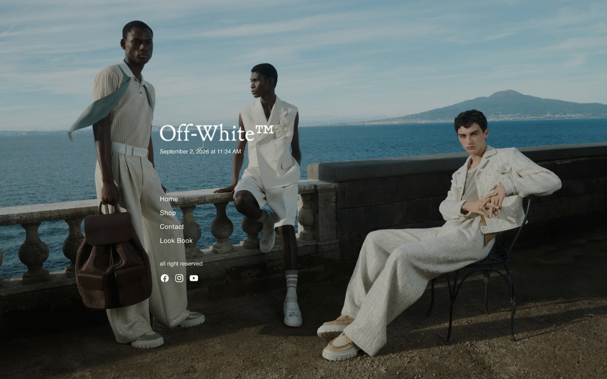 Three models wearing Off-White streetwear outfits pose on a stone terrace overlooking the sea. The models are dressed in light beige and white textured knit and woven clothing, with one holding a brown leather bag.